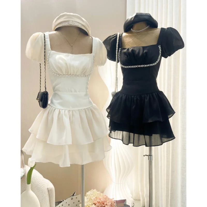 Đầm tơ đính đá ngực 2 màu đen kem Colyn - Ảnh 3