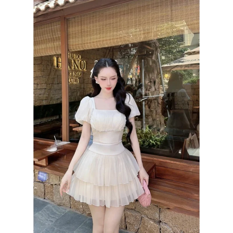 Đầm tơ đính đá ngực 2 màu đen kem Colyn - Ảnh 4